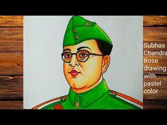 a drawing of a man with glasses and a green hat is featured on a wooden surface