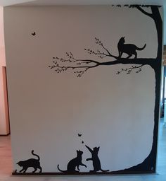 this is an image of cats in the tree with butterflies on its back wall decal