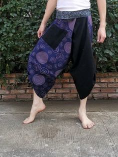 Item details Materials cotton,  hmong fabric, thai, japanese print FEATURE: Handmade Ethically, Breathable, Unisex, Comfortable to Wear & Stylish. indigo MATERIAL: 100% Cotton, Handmade  COLOR: Black Sizing : Tie Waist or Wrap pants Waist up to : 21 inch 44 inch ( 53.36 -111.75 cm ) Hip up to : 64 inch ( 142 cm ) Length     : 34 inch ( 78 Cm ) 1 Pocket Special Promotion  -Shipping by priority mail to USA Next all item get Free priority mail to USA  Non USA shipping by Air Mail registered. GENDER: M/F This beautiful samurai pants is unique & comfortable to wear. Handmade with very lovely pattern, it is easy to wear and great for many occasions. Unique handmade embroidered waist patches are made with Cotton fabric, each pair are a slight different which makes them an one-of-a-kind. One size Black Patchwork Bottoms For Festival, Bohemian Purple Bottoms With Pockets, Casual Purple Pants For Festival, Hmong Fabric, Mens Summer Pants, Samurai Pants, Cotton Harem Pants, Fisherman Pants, Pants Comfy