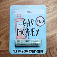 an advertisement for gas money is shown on a wooden table with the words $ 50