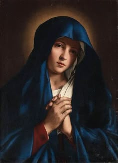 a painting of a woman wearing a blue shawl and holding her hands together in prayer