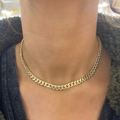 This Cuban Link Chain is perfect for layering, as it pairs exquisitely with nearly any other necklace style. Not into layering? Not to worry! The Classic Cuban Link stands alone beautifully! This lustrous gold chain glistens effortlessly along the collarbone, creating just the right amount of embellishment for everyday wear. Metal: 14k Yellow Gold Gold Weight: Approx. 8.90 grams Polished Gold Lightweight Length: 16 inches with 2" of jump rings for versatile wear Closure: Lobster Clasp Chain Width: approx. 5.9mm Looking for a different length? Please email us. Gold Chain Women, College Rings, Cuban Link Necklace, Solid Gold Chains, Tennis Necklace, Band Bracelet, Cuban Link Chain, Bridal Bands, Cuban Link