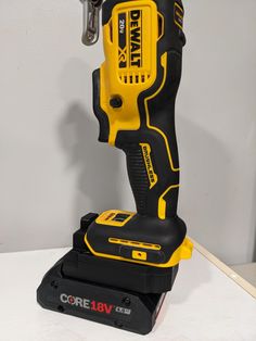 a cordless drill is sitting on top of a box