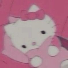 the hello kitty doll is wearing a pink dress