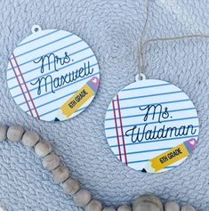 two personalized christmas ornament hanging on a blanket