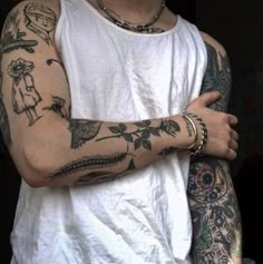 a man with many tattoos on his arm