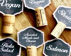 wine corks with labels on them sitting on a table