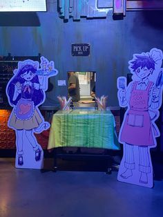 three paper cutouts of cartoon characters standing in front of a table