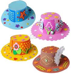 three colorful hats with designs on them sitting next to each other