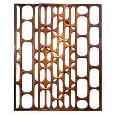 an old metal grate with holes and circles on the side, isolated against a white background