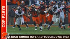 a group of football players running on top of a field