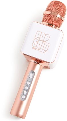 a microphone that is on top of a white surface with the words god stop written on it