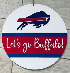 a sign that says let's go buffalo on it