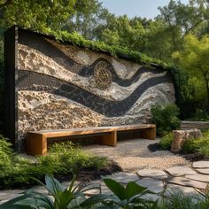 a bench sitting in front of a stone wall covered in plants and rocks with a clock on it's side