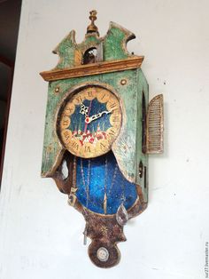 an old clock is hanging on the wall