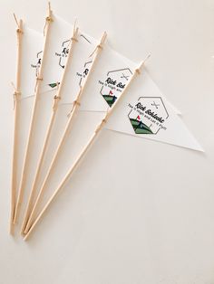 six sticks with labels on them sitting next to each other