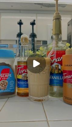 a counter top with various types of condiments on it