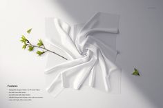 a white sheet with green leaves on it