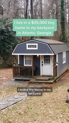 a tiny house in the woods with a sign that says i live in a $ 350, 000 tiny home in my backyard in atlanta, georgia