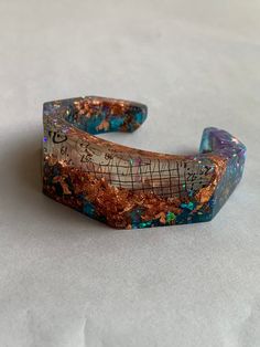 "This listing is for the handmade and one of a kind, Geometric Purple and Blue Iridescent Resin Cuff with Copper Bracelet. The bangle is in new condition and one of a kind. The entire width of the cuff is 3\", the interior width is 2.75\". The cuff opening is 1.25\" wide. The cuff band is 2.5 centimeter wide x 1 centimeter thickness. Please follow our shop link for more hand made jewelry, art and vintage. https://www.etsy.com/shop/CandilandArt I try my best to make each piece perfect. All of our Diy Resin Gifts, Iridescent Resin, Resin Gifts, Backyard Hammock, Flying Monkeys, Resin Jewelry Diy, Resin Bangles, Resin Bracelet, Jewelry Resin