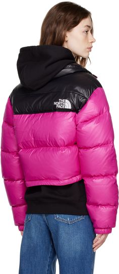 Down-filled quilted nylon ripstop jacket. · Stand collar · Zip closure · Logo patch at front and back · Zip pockets · Bungee-style drawstring at hem · Adjustable velcro straps at cuffs · Full taffeta lining Supplier color: Fuchsia pink Fill: 85% waterfowl down, 15% waterfowl feathers. Nuptse Short Jacket, The North Face Jacke, Pink North Face Jacket, The North Face 1996 Retro Nuptse, North Face Outfits, Retro Nuptse Jacket, Down Winter Coats, North Face Nuptse, North Face Shorts