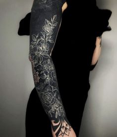 a woman with a tattoo on her arm