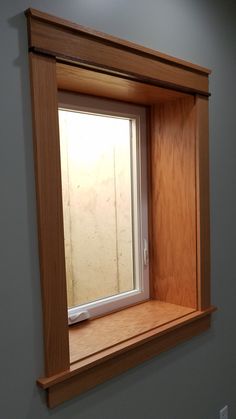 an empty window in the corner of a room