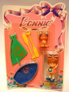 a toy doll with accessories in its package