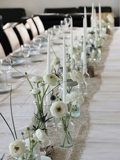 a long table with white flowers and candles on it is shown in an instagram