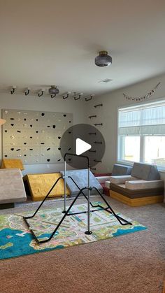 a living room filled with lots of furniture and decor on top of carpeted flooring