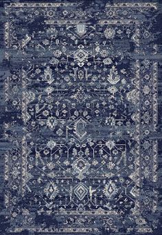 a blue rug with an ornate design on the top and bottom, it is very dark