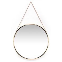 a round mirror hanging on a chain