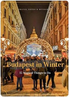 the cover of budapest in winter, with people standing outside and looking at christmas lights