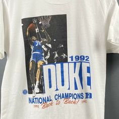 Vintage Duke Blue Devils Ncaa National Champions 1991 Back To Back 1992 T-Shirt, 1992 Duke National Champions Shirt, Anniversary Gift Product Information Promise That You Will Get The Best Products We Have. With Variety Of T Shirts Styles, Sizes And Colors. Detail T-Shirt: 100% Premium Cotton Short Sleeve Unisex T-Shirt. Suitable For Ladies And Gentlemen. Natural And Organic Dyes Are Used And No Harmful Effects To Human Health. Fabric Weight: 5.0 Oz (Mid-Weight). Double-Stitched Seams At Shoulde Vintage College Tshirt, Vintage Soccer Shirts, Vintage Sports Shirts, Vintage T Shirt Design, Vintage Graphic Tees, Vintage College Shirts, College Tshirts, Brooklyn Shirt, Graphic Band Tees