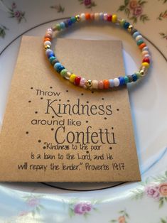 a bracelet that says, they know kindness around like confetti