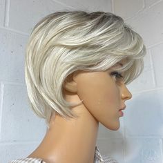 Elegant And Classy This Is A Classic Pixie Cut Wig Light Layers Shaggy Bangs High On Neck Parting Is From Crown ( No Part) With Mid Or Side Hangmannequin Head Is Very Small, Still A Very High Nape Neck Cut 8” Front Layers From Crown 9” From Crown At Back Washable Easy Care Synthetic Heat Resistant Roots Are Brown In Most Lights And Daylight It’s A Platinum Blonde In Electric Light Quite Icy White Not Fake Shiny Thick Quality Wig 190% Density No Low Offers Browse Our 300+ Nwt Wigs Shaggy Bangs, Front Layers, Layers Bangs, Platinum Blonde Pixie, Classic Pixie, Platinum Pixie, Layers And Bangs, Bangs Wig, Light Layers