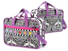 two black and white bags with designs on the front, one has pink trimmings