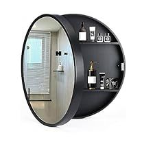 a bathroom with a round mirror on the wall and shelves in front of it that are filled with bottles