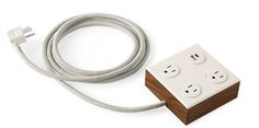 an electrical outlet with two plugs and a white cord attached to the outlet, on a white background