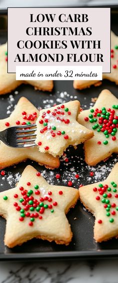 christmas cookies with sprinkles and a fork on a baking sheet that says low carb christmas cookies with almond flour made in under 3 minutes