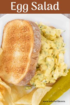 an egg salad with potato chips on a white plate