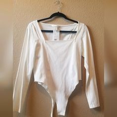 H&M Cream/White Long Sleeve Body Suite Size: M Condition: New Excellent Condition Fitted H&m Top For Day Out, Trendy White H&m Top, H&m White Tops For Spring, Fitted Off White Cotton Top, Casual White Top From H&m, Stretch Off White Top For Spring, Off White Stretch Tops For Spring, Stretch Off White Tops For Spring, Spring Stretch Off White Tops