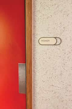 a red door with a sign that says women on it