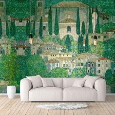 a living room with a large mural on the wall and couches in front of it