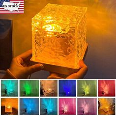 an image of a cube shaped light that is glowing in different colors and sizes, with the