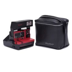 the polaroid camera case is black and has red trimmings on it's sides