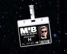 an id card with a bar code attached to it, in front of some stars