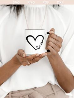 a woman holding a coffee mug with the word love on it