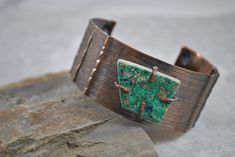 "Handcrafted rustic copper cuff created by hammering, annealing, form folding, drilling, filing, and adding an antique patina. A flat turquoise layer stone has been attached through the use of prongs The piece has been tumbled for polishing. The inside of this bracelet has been treated with acrylic to prevent tarnish on your skin.  I love making these bracelets and hope you will enjoy wearing one too! INSIDE FIT:  The inner circumference is 6.75\" with a 1\" gap  17.2 cm  with gap 2.54 cm This cuff would be considered a medium size. 1 1/4\" wide   3.17 cm  Sizing: Cuffs have approximately a 1\" - 1 1/4\" opening and this can be adjusted either way with slight pressure for your custom fit. This allows you to use the gap in the bracelet for putting on and taking off.  Your cuff will be place Handmade Southwestern Copper Jewelry, Rustic Handmade Cuff Bangle Bracelet, Handmade Rustic Bangle Jewelry, Handmade Rustic Style Bangle Jewelry, Artisan Rust-colored Metal Jewelry, Rustic Handmade Bangle Jewelry, Adjustable Copper Artisan Cuff Bracelet, Artisan Copper Cuff Bracelet Adjustable, Adjustable Artisan Copper Cuff Bracelet