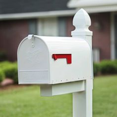 a white mailbox in front of a house